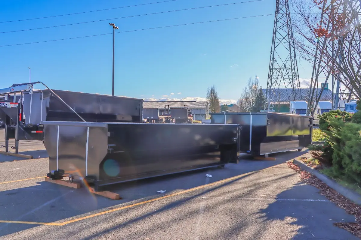 Roll-off dumpster ready for waste disposal at job site for Roofing Dumpster Rental in Prien